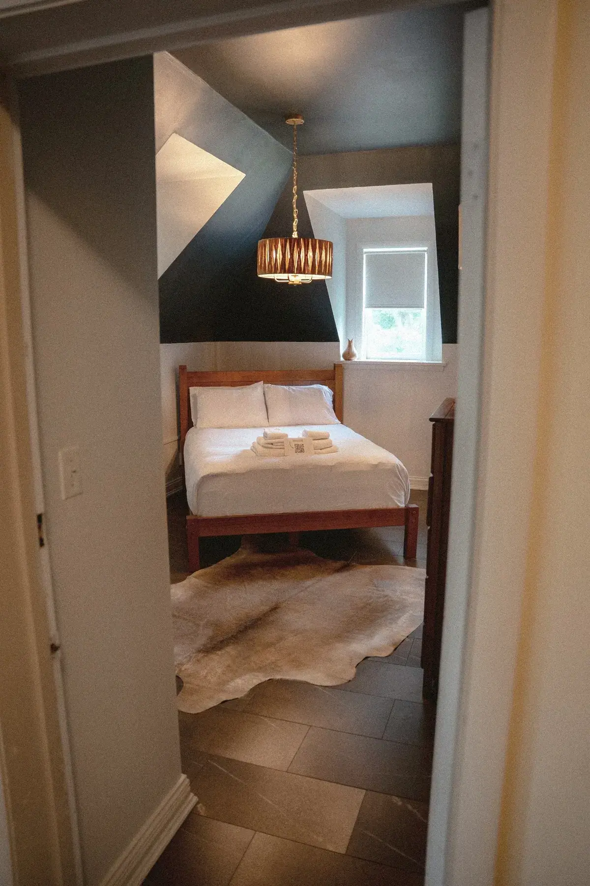 Compact room with black-and-white palette through doorway