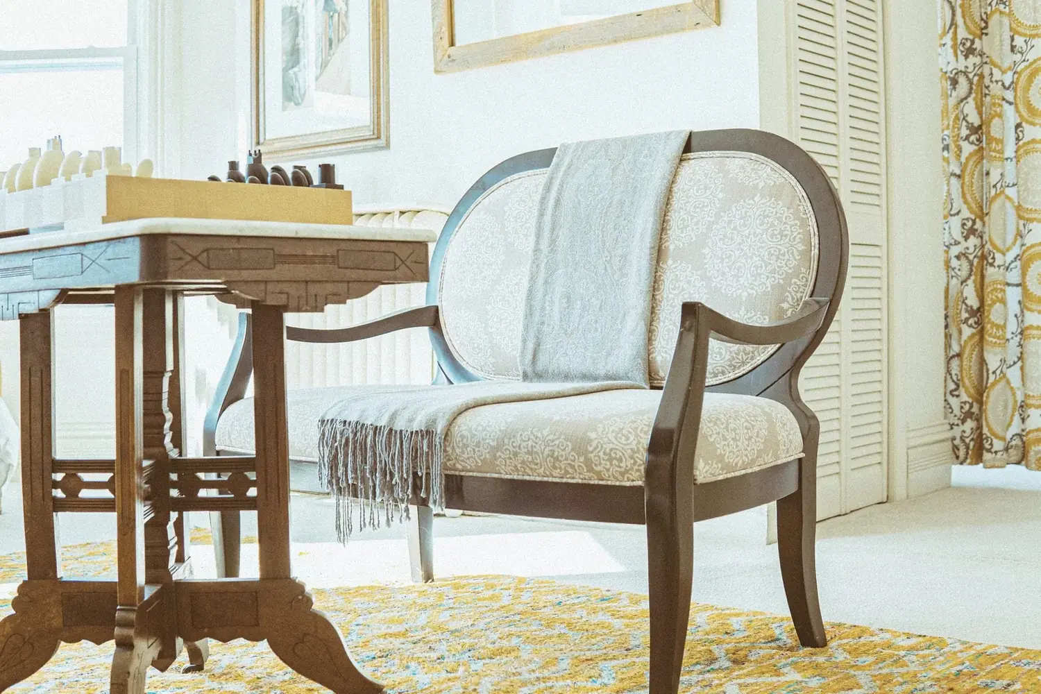 Game table with golden rug and patterned drapery