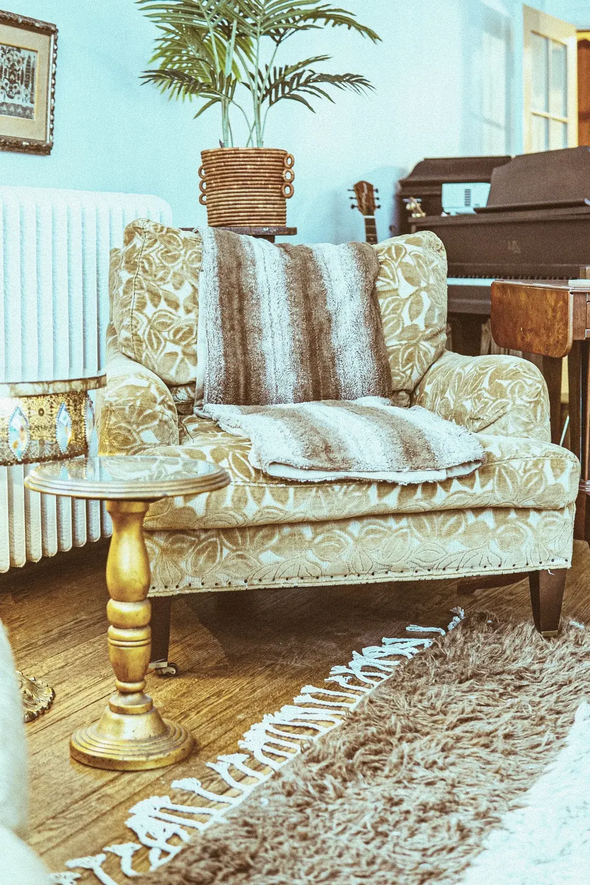 Piano corner with cozy chair, throw, and layered textures