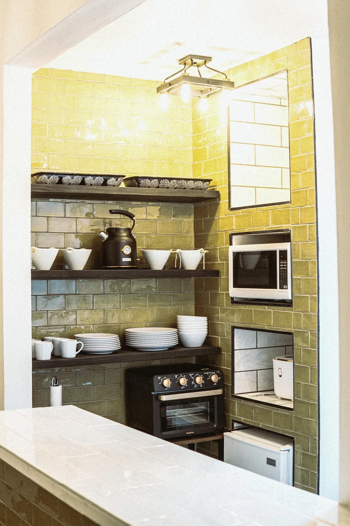 Green and gold tile kitchenette